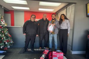 CARSTAR Academy Scholarship award winner, Centennial College autobody student Hekmatull Ahahmadi , and the team at CARSTAR at CARSTAR Toronto Millwick. (Image courtesy CARSTAR)